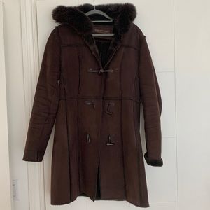 Marc coat, poly suede exterior, “soft cozy” lining with fox lined hood.